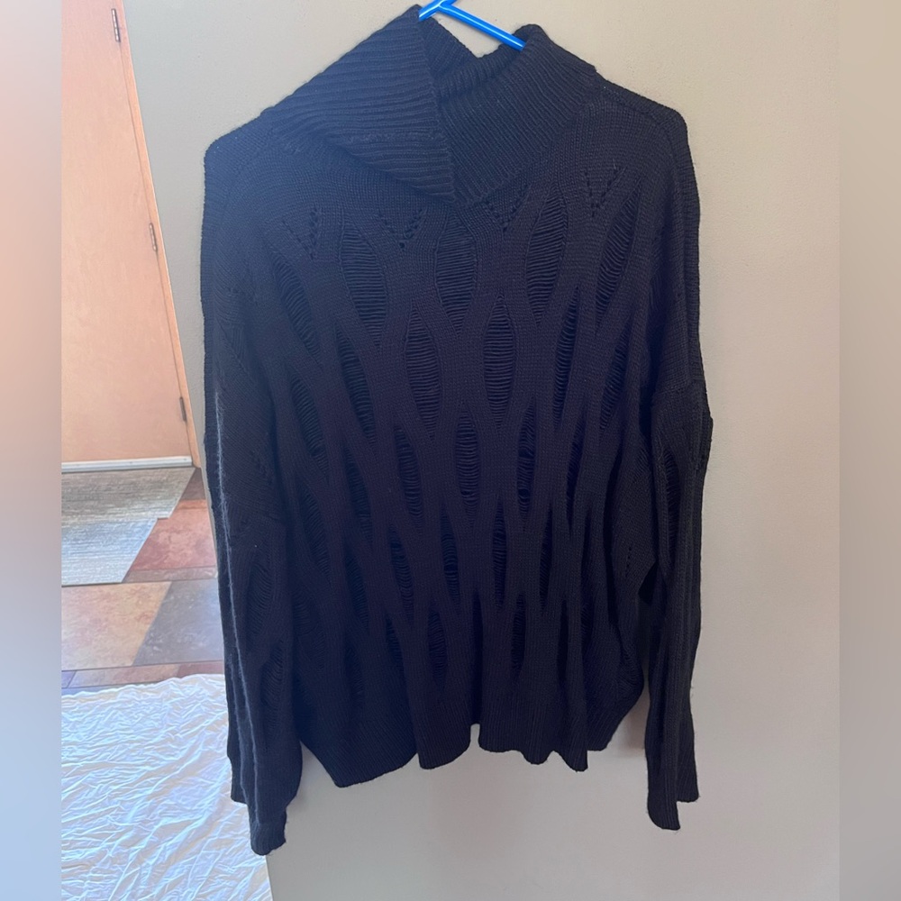 Black distressed turtleneck sweater